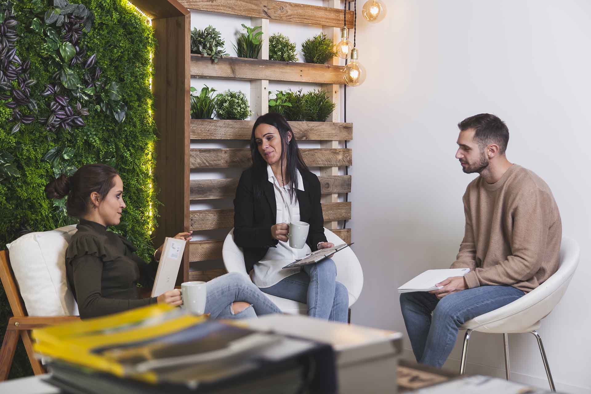 Woman having a conversation with a man and another woman. She is happy to be sober