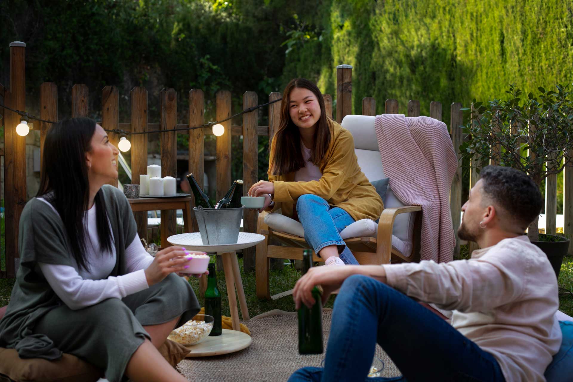 Group of friends drinking outside with snacks